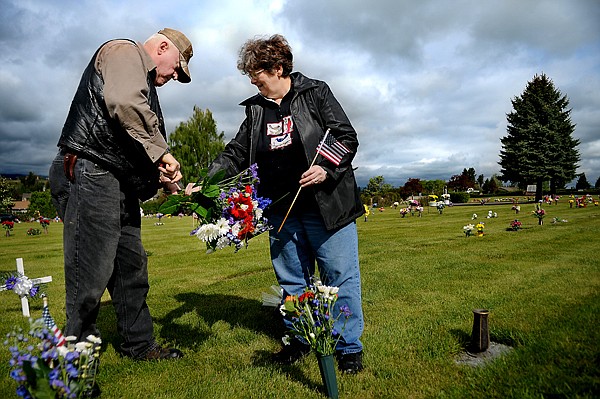 &lt;p&gt;Lloyd and Eileen Pierson of Kalispell prepare to lay flowers on the grave of Clyde and Evelyn Pierson, Lloyd's parents, on Monday, May 28, before the start of the Memorial Day celebration at Glacier Gardens in Kalispell. Clyde Pierson served in the U.S. Navy aboard the U.S.S. Marshall during World War II.&lt;/p&gt;