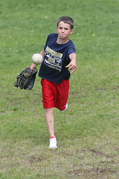 Anthony Parkin pitches during the first inning of the sixth-graders versus teachers softball game at Superior Elementary School Friday. The students lost the game 18-2.