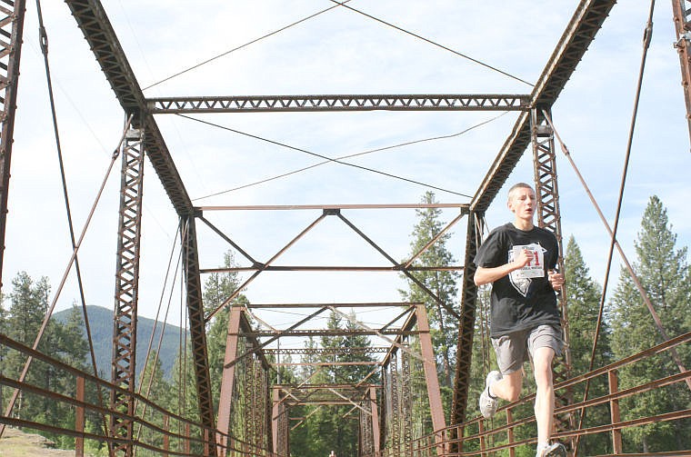 &lt;p&gt;Caleb Hamner runs toward the finish line back over the bridge that leads to the Island Park in Thompson Falls.&lt;/p&gt;