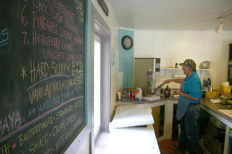 &lt;p&gt;Tom Peterson makes ice cream in the background. Ripples Ice Cream Parlor opened on June 1.&lt;/p&gt;