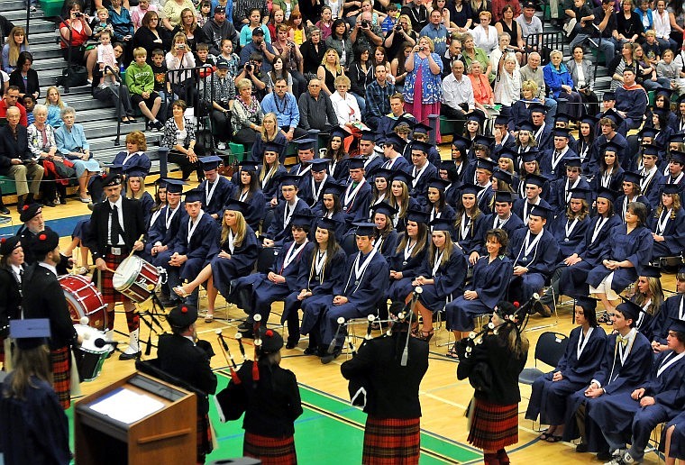 Glacier Graduating Seniors look on as The Montana Highlanders perform The Graduation Salutation.