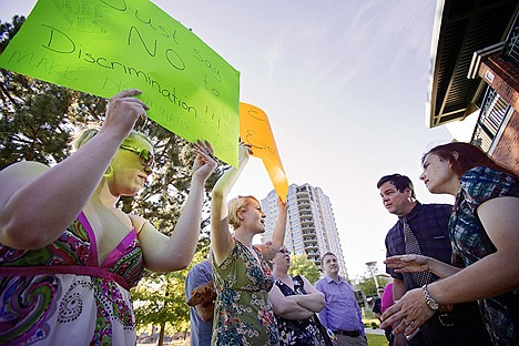 &lt;p&gt;Jenny Vanderhoef, left, and Erin Lyke,&#160;debate their position in support of non-discrimination regulations with two individuals who refused to give their names and do not support the regulations. Due to a maximum capacity of attendants to Tuesday's meeting, many had to wait outside of the city council meeting at the Coeur d'Alene Public Library until space was available in the library's community room.&lt;/p&gt;