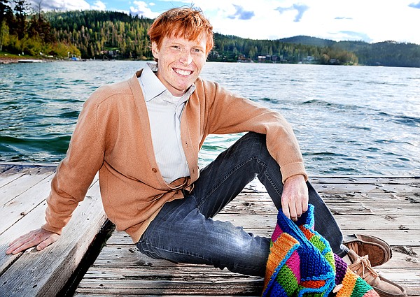 Brett Harrison sitting on the dock at his home at Foys Lake on Tuesday evening in Kalispell. Harrison graduates from Flathead High School on Saturday. This fall he will be attending Dartmouth College.