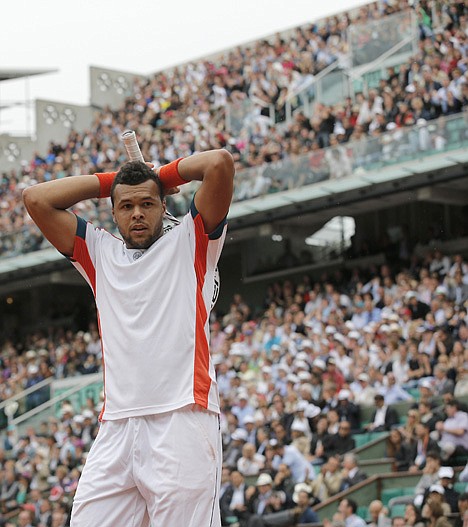 &lt;p&gt;CHRISTOPHE ENA/Associated Press Jo-Wilfried Tsonga of France holds his racket over his head en route to losing to Novak Djokovic of Serbia in five sets in the quarterfinals of the French Open on Tuesday in Paris.&lt;/p&gt;