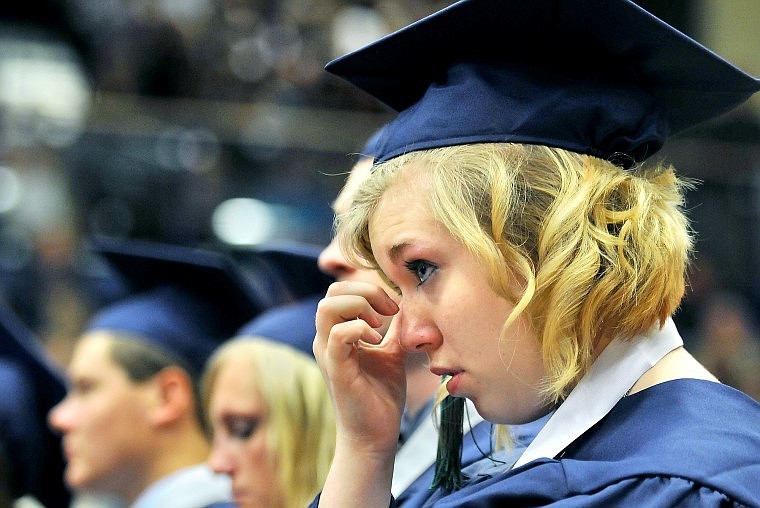 Glacier Graduating Senior Cassy Brown wipes a tear away from her eye during her school's Commencement Ceremony.