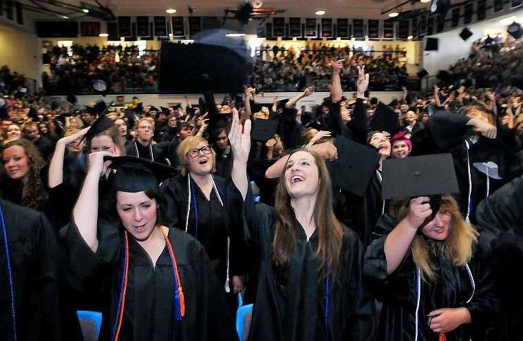 Flathead Graduating Seniors toss their caps into the air at the end of Saturday's ceremony.