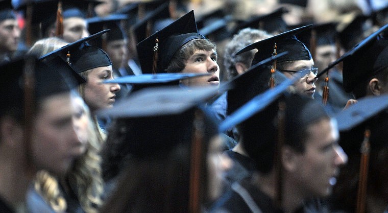 A Flathead High Graduating Senior looks up from his seat during the ceremony.