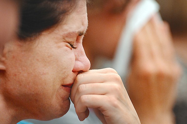 Adrienne Johnson, a longtime friend of Erin Thompson, cries as she listens to members of Thompson's family give their remarks before the sentencing of Justine Winter on Monday in Kalipsell.