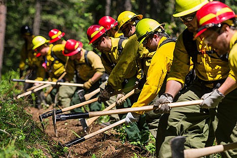 &lt;p&gt;Tony Smith, with the Priest Lake Ranger District of the U.S. Forest Service, works with fellow firefighters to dig a fire line during a training exercise.&lt;/p&gt;