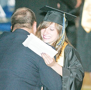 &lt;p&gt;Salutatorian Alyssa Walker receives a congratulatory hug from Vice Principal Jim Germany.&lt;/p&gt;