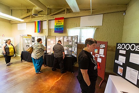 &lt;p&gt;Amy Echelberger, of Post Falls, reads a part of the 2014 LGBT Pride Exhibit that includes information on gay rights from the 2000s Friday at the Human Rights Education Institute in Coeur d&#146;Alene.&lt;/p&gt;