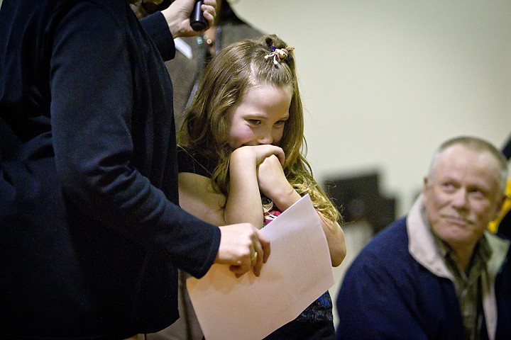 &lt;p&gt;JEROME A. POLLOS/Press Amy Palmer, a second-grade student from Athol Elementary, shows her nervousness as her nomination essay is read for the May First Class School Champion Award during an assembly Wednesday. Palmer nominated Barry Thackston, left, her bus driver, and stated, &quot;I don't have a grandpa, but if I did I wish he was just like Mr. Barry.&quot;&lt;/p&gt;