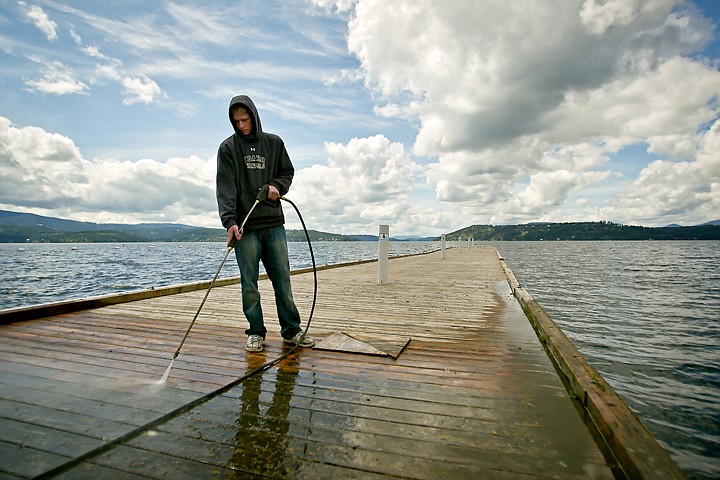 &lt;p&gt;JEROME A. POLLOS/Press Zac Loy pressure washes a dock Tuesday at The Coeur d'Alene Resort Golf Course under cloudy skies. The break in the wet weather only lasted the day as more rain is forecasted through the week.&lt;/p&gt;