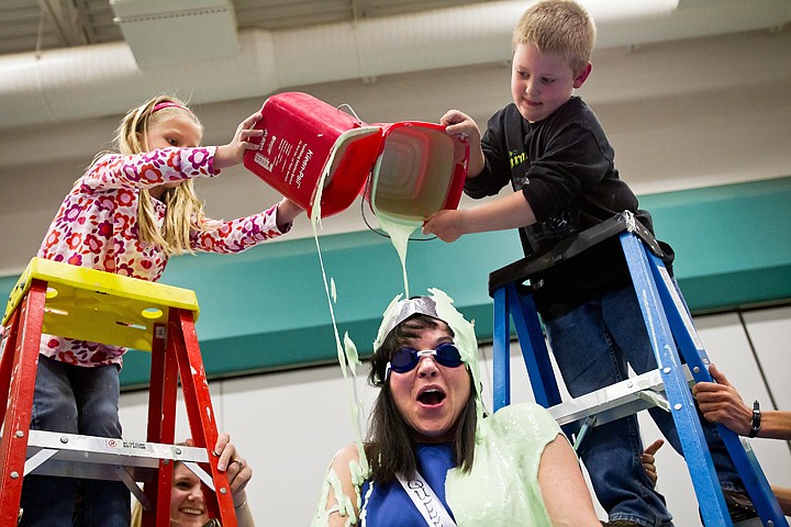 &lt;p&gt;SHAWN GUST/Press Principal at Hayden Meadows Elementary, Lisa Pica, is slimed Friday by top raffle sellers, Abbey Whiting, a first-grader and kindergartener Conner Hansen Friday during an assembly. Students raised $16,580 through raffle sales in three weeks. The total was beyond a set goal and earned the top sellers in each grade a chance to pour slime on the principal and two other teachers.&lt;/p&gt;