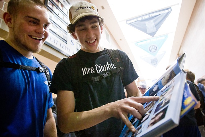 &lt;p&gt;SHAWN GUST/Press Daniel Zebedio, left, and Tre Cameron, seniors at Lake City High, take a first look at the 2010 yearbook Wednesday after classes. Of the more than 930 yearbooks ordered, nearly 300 of them were available to the senior class a day earlier than other students.&lt;/p&gt;
