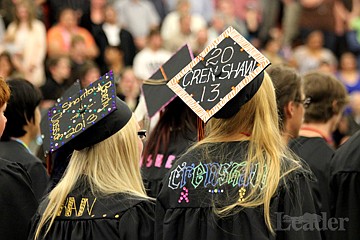 &lt;p&gt;Photo by Jessica Stugelmayer. Shantay Cran and Victoria Crenshaw sport customized caps and gowns during the graduation ceremony.&lt;/p&gt;