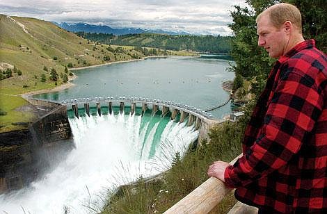 Chris Jordan/Daily Inter LakeTerry McAllister of Bigfork checks out Kerr Dam near Polson on Wednesday afternoon. PPL Montana opened the dam gates to spill 47,400 cubic feet of water per second to help prevent flooding on the main stem of the Flathead River above Flathead Lake.