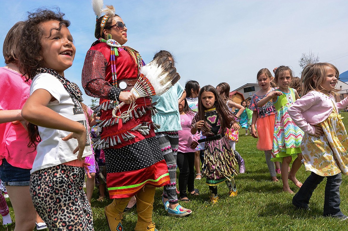 &lt;p&gt;Naomi Billedeaux leads girls around in a circle at Cherry Valley Elementary during a powwow on June 1.&lt;/p&gt;