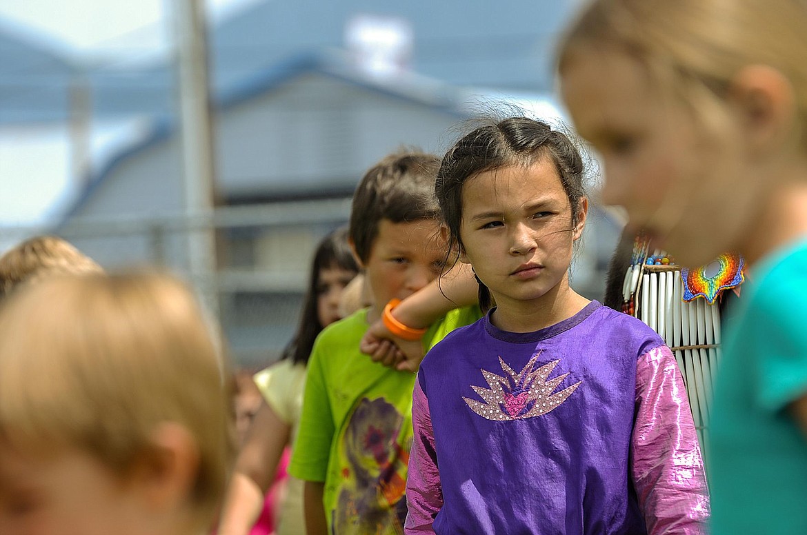 &lt;p&gt;Reese Decoteau waits for her classmates to move forward during a circle dance at Cherry Valley Elementary during a powwow on June 1.&lt;/p&gt;