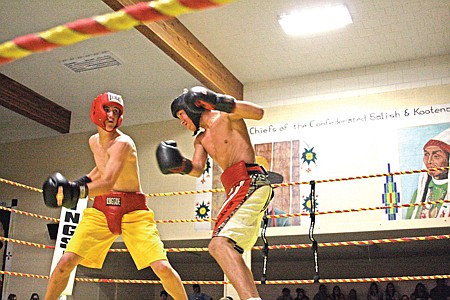 Mission&#146;s Dylan Evans takes a swing at Arlee&#146;s Christian Haynes. Evans won in a split decision.