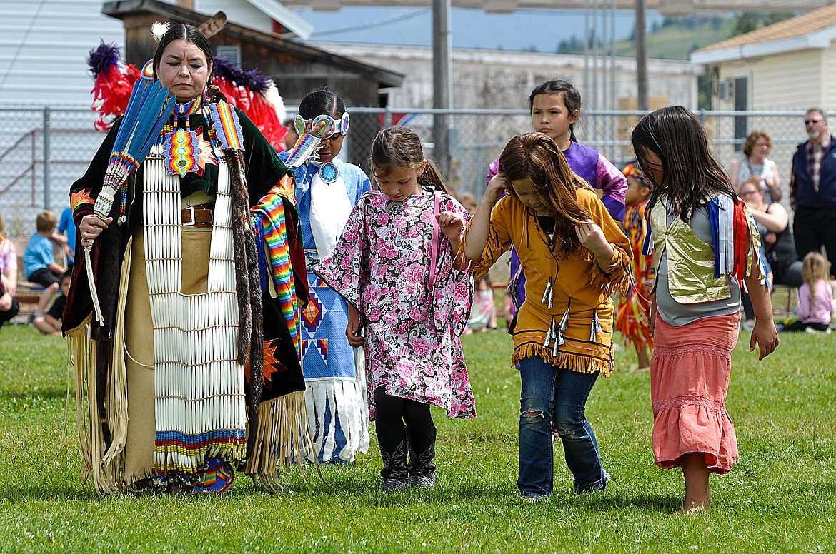 &lt;p&gt;From left, Claire Charlo shows Aleysia Black,Lara Duran, and Ahliana Red Crow Gieber how to dance a traditional women's dance during a powwow at Cherry Valley Elementary on June 1.&lt;/p&gt;