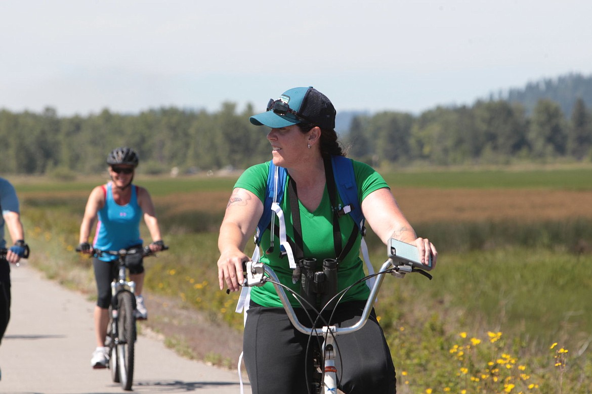 &lt;p&gt;Carrie Hugo, wildlife biologist with the Bureau of Land Management's Coeur d'Alene office, instructed a group of more than 20 people about the many different species of birds along the trail of the Coeur d'Alenes near Medimont Sunday during a bird-watching bicycle expedition organized by James Blakely from Idaho Parks and Recreation.&lt;/p&gt;