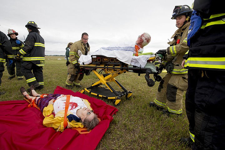 &lt;p&gt;As part of the Cascadia Rising training scenario, more than 70 first responders participated in a training exercise for a two-plane crash on Friday, June 10, 2016 at the Coeur d'Alene Airport. To make the scenario realistic, 24 volunteers acted as victims of the crash, and first responders had to assess and treat the victims on-scene as they would in a real crash. To purchase photo, please visit cdapress.com/photos&lt;/p&gt;