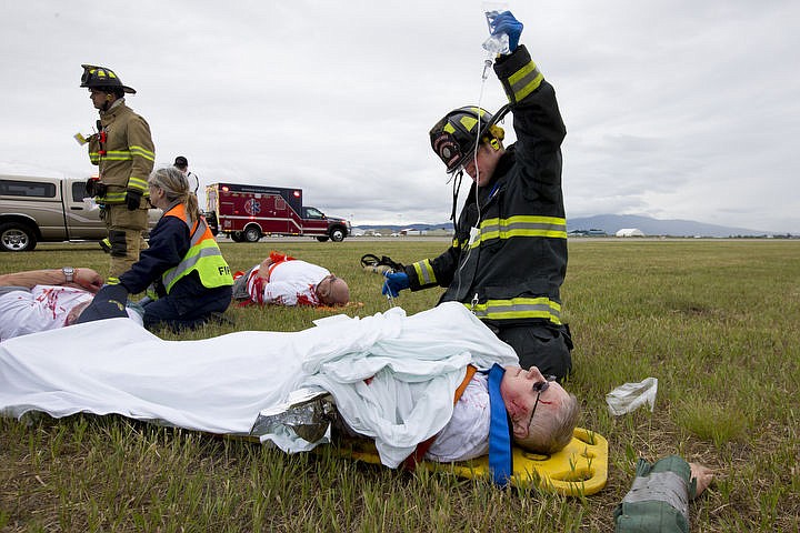 &lt;p&gt;As part of the Cascadia Rising training scenario, more than 70 first responders participated in a training exercise for a two-plane crash on Friday, June 10, 2016 at the Coeur d'Alene Airport. To make the scenario realistic, 24 volunteers acted as victims of the crash, and first responders had to assess and treat the victims on-scene as they would in a real crash. To purchase photo, please visit cdapress.com/photos&lt;/p&gt;