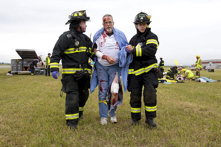 &lt;p&gt;As part of the Cascadia Rising training scenario, more than 70 first responders participated in a training exercise for a two-plane crash on Friday, June 10, 2016 at the Coeur d'Alene Airport. To make the scenario realistic, 24 volunteers acted as victims of the crash, and first responders had to assess and treat the victims on-scene as they would in a real crash. To purchase photo, please visit cdapress.com/photos&lt;/p&gt;