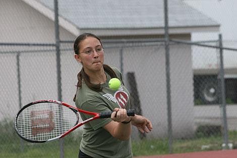 Photo by Nick Ianniello Michele Reinelt returns the ball during tennis camp at the Superior tennis courts Thursday.