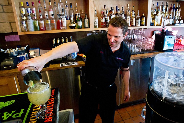 &lt;p&gt;Wes LeDoux, manager at Azteca Southwest Grill in Coeur d'Alene, pours a margarita into a glass Wednesday before serving it to a customer. The Riverstone restaurant purchased a liquor license last month.&lt;/p&gt;