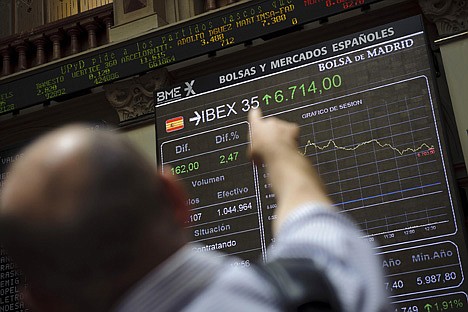 &lt;p&gt;A visitor points his finger towards the Stock Exchange's main display, in Madrid, Monday June 11, 2012. After Spain's request for a European financial lifeline of up to a euro100 billion euros ($125 billion) to save its banks the EU made clear the money is more than just a loan. Besides being paid back with interest, there will be strings attached for the Spanish government.(AP Photo/Daniel Ochoa de Olza)&lt;/p&gt;