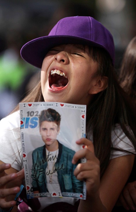 &lt;p&gt;A fan of pop star Justin Bieber cheers outside a hotel where Bieber gave a news conference in Mexico City, Monday, June 11, 2012. Bieber will perform in a free open-air concert tonight at the Mexico City's main historic plaza, the Zocalo. (AP Photo/Alexandre Meneghini)&lt;/p&gt;