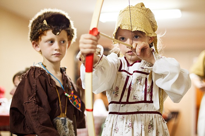 &lt;p&gt;SHAWN GUST/Press Rachel Arnold, a first grade student at Classical Christian Academy in Post Falls, demonstrates how to shoot a toy bow and arrow for classmate Ethan Sorensen during a Pioneer Days celebration Tuesday as part of Idaho history and Oregon Trail learning activities.&lt;/p&gt;