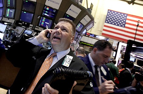 &lt;p&gt;Trader George Ettinger, left, works on the floor of the New York Stock Exchange Monday, June 11, 2012. Stocks are opening higher on Wall Street, following markets higher across the globe after European countries said they would lend Spain as much as $125 billion to save its banks. (AP Photo/Richard Drew)&lt;/p&gt;