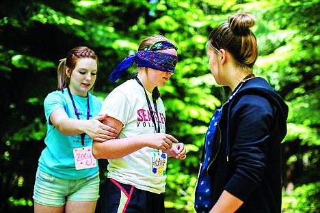 &lt;p&gt;Zoey Stark, 16, helps a blindfolded&#160;Katie Swan,16, balance on a log as she navigates around Hannah Swenson,15, so their team can arrange themselves in alphabetical order. Twenty-two groups participated in different team building challenges at Camp Lutherhaven for the Idaho Drug Free Youth (iDFY) Summit camp.&lt;/p&gt;