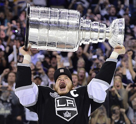 &lt;p&gt;Los Angeles Kings captain Dustin Brown hoists the Stanley Cup after the Kings beat the New Jersey Devils 6-1 during Game 6 of the NHL hockey Stanley Cup finals, Monday, June 11, 2012, in Los Angeles. (AP Photo/Mark J. Terrill)&lt;/p&gt;