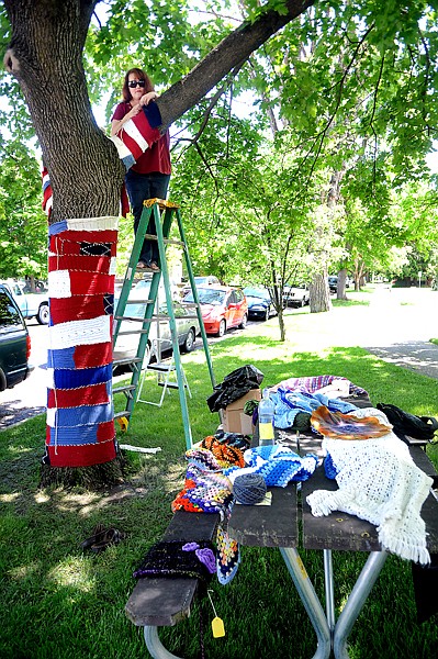<p>Jodie Coston, a Somers knitter, led the yarn bombing effort at the Hockaday.</p>