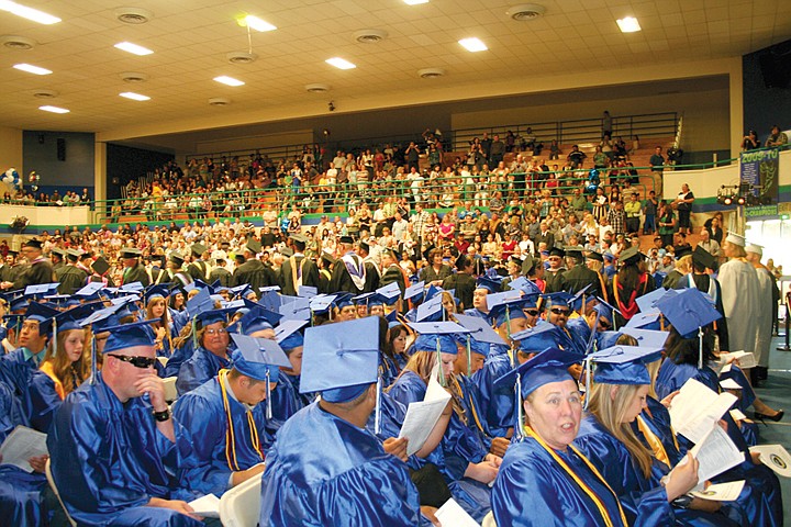 Big Bend Community College students wait to receive their diplomas during their commencement ceremony Friday.