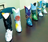 High schools paint boots for fundraiser