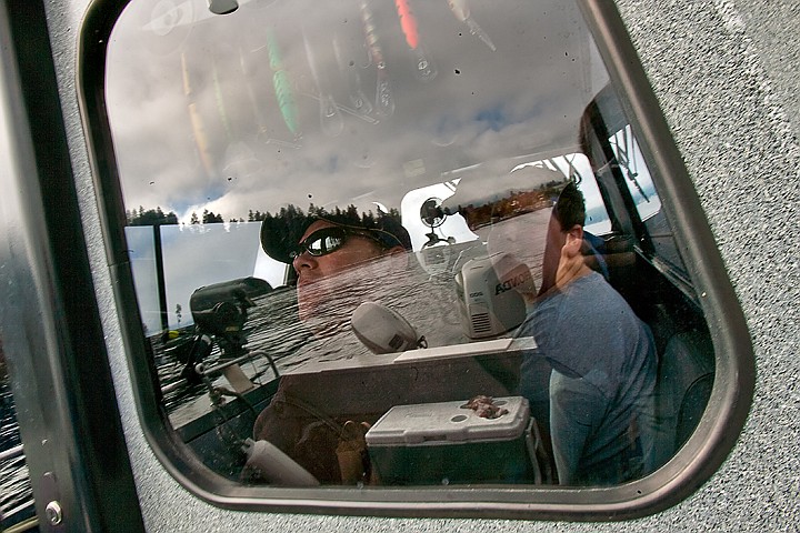 &lt;p&gt;Matt Plaisted, left, looks up at a hanging row of trout lures in Roger Blackstone's boat, &quot;The Fish Whisperer,&quot; as Blackstone takes out a Big Brothers group Saturday.&lt;/p&gt;