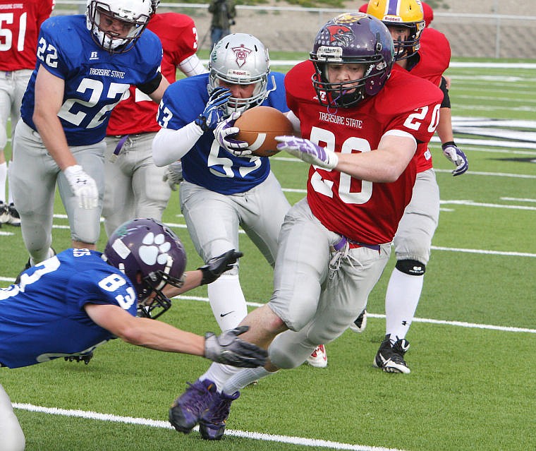 &lt;p&gt;Red All Star Tyler Delaney of Charlo breaks to the outside to avoid Xavier Harris's tackle during the first quarter of the Bob Cleverly Class C All Star Football game Saturday night.&lt;/p&gt;