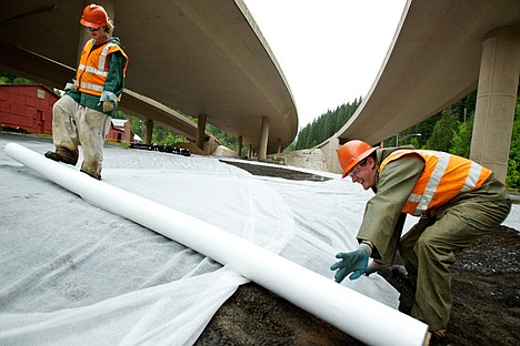 &lt;p&gt;Matt Seaton, right, and Stephanie Brunner, with Ferguson Contracting, rolls out fabric over a reclaimed 1.5-acre section Monday under Interstate-90 in Wallace. The Department of Justice announced that Hecla Mining Company settled with the U.S., the state of Idaho and the Coeur d'Alene Tribe on a suit concerning claims over mining waste related damages. Hecla will pay the entities $263.4 million, all of which will go toward ramped up cleanup efforts in the lower and upper Coeur d'Alene basins.&lt;/p&gt;