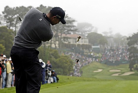 &lt;p&gt;Tiger Woods hits a shot on the 18th hole during a practice round for the U.S. Open Championship golf tournament Wednesday, June 13, 2012, at The Olympic Club in San Francisco. (AP Photo/Charlie Riedel)&lt;/p&gt;