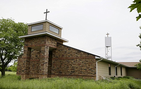 &lt;p&gt;A cellphone tower inside the bell tower, rear right, is seen over the Resurrection Lutheran Church in Ankeny, Iowa, on Tuesday.&lt;/p&gt;