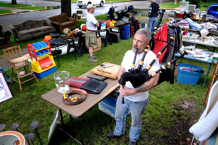 &lt;p&gt;Rod Douglas, pipe major with the Montana Highlanders Association pipe and drum band, adds a touch of Celtic flair to the band's garage sale on Friday afternoon, June 8, by playing the bagpipes as visitors sift through the items for sale. The band held the sale this weekend to raise funds for their new uniforms. The sale continues Saturday and is being held at the intersection of 4th Avenue E and 9th Street across from Hedges School in Kalispell.&lt;/p&gt;