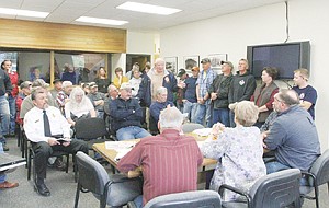 &lt;p&gt;Cabinet View Fire Service Area Board of Trustees Chairman Bill Clark, standing center, addresses the commissioners. Clark asked Commissioners whether they would forego the phone number requirement for petitioners, stating some of the people out there do not have phones.&#160;&lt;/p&gt;