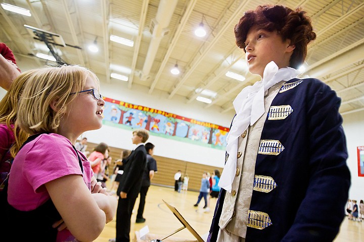 &lt;p&gt;SHAWN GUST/Press Taegan Williams, a fifth-grader at Ponderosa Elementary School, recites information about his character, Thomas Jefferson, as first-grader Amira Davis listens during an event Tuesday at the Post Falls school. Dozens of student dressed like historical figures and presented their stories as if they were characters in a wax museum.&lt;/p&gt;