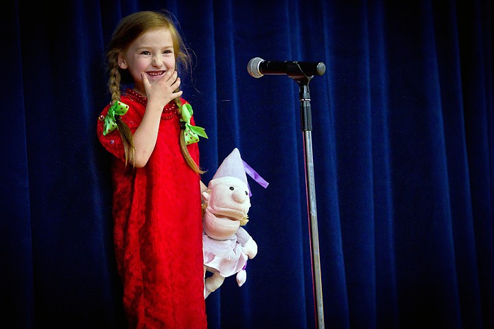 &lt;p&gt;JEROME A. POLLOS/Press Bella Mitchell prepares her smile before singing the song &quot;Miss Lucy&quot; during the Borah Elementary talent show Tuesday.&lt;/p&gt;