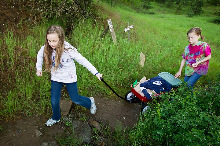 &lt;p&gt;SHAWN GUST Borah Elementary fourth-graders Nicole Sargent, left, and Bailey Grat prepare to get their wagon of supplies across the first of a handful of river crossings as part of the class's Oregon Trail field trip.&lt;/p&gt;